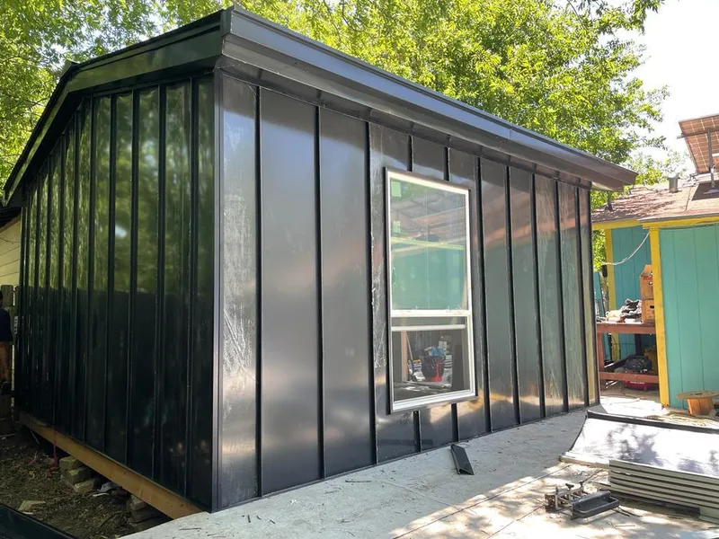 Black standing seam metal wall panels for Roof Inspection in Moores Mill